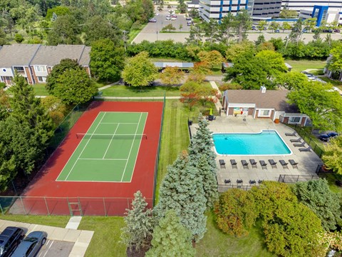 Aerial view of spacious pool and tennis courts at Park Lane Apartments in Southfield, MI